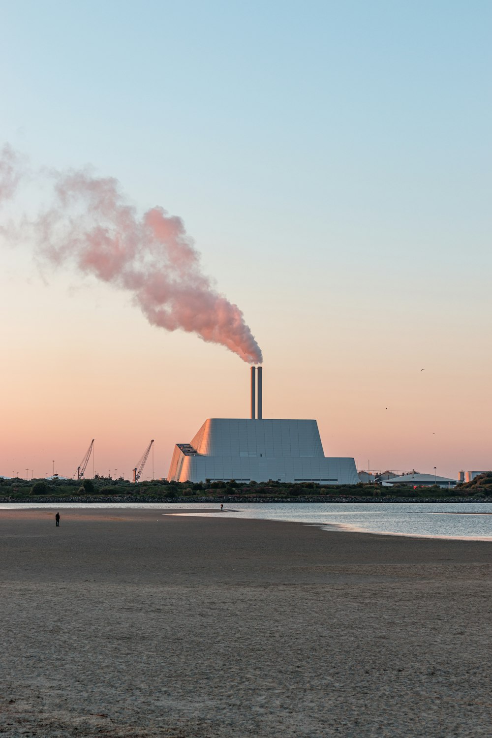 a factory with smoke coming out of it