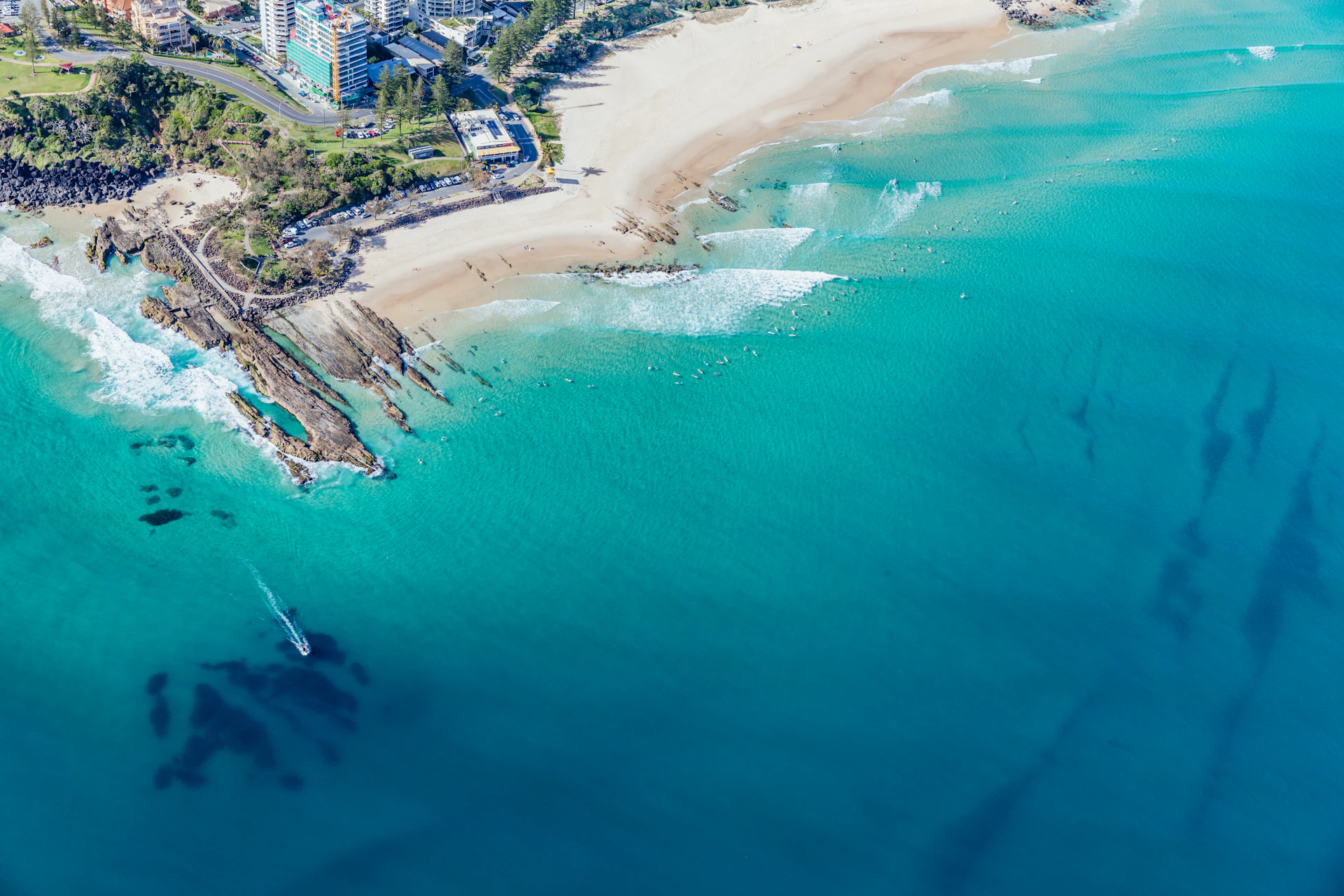 an aerial view of a beach and a city