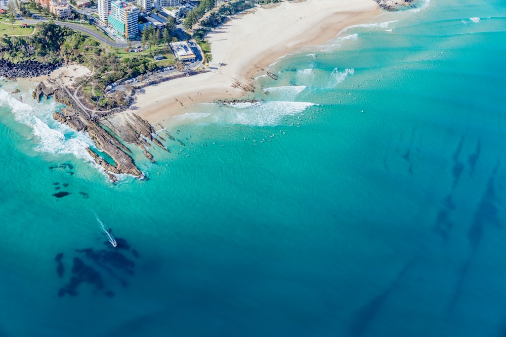 an aerial view of a beach and a city