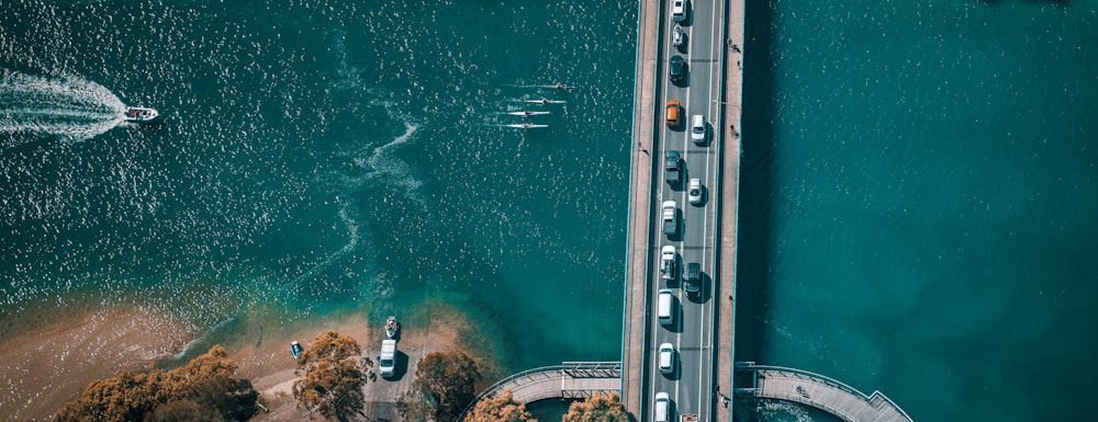 an aerial view of a bridge over a body of water