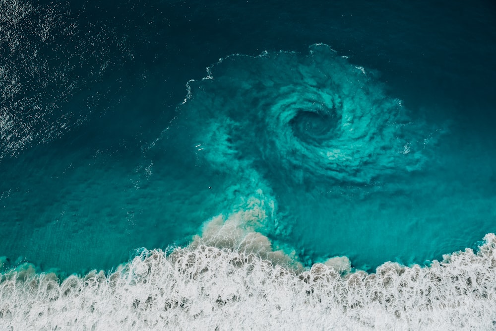 an aerial view of a large wave in the ocean