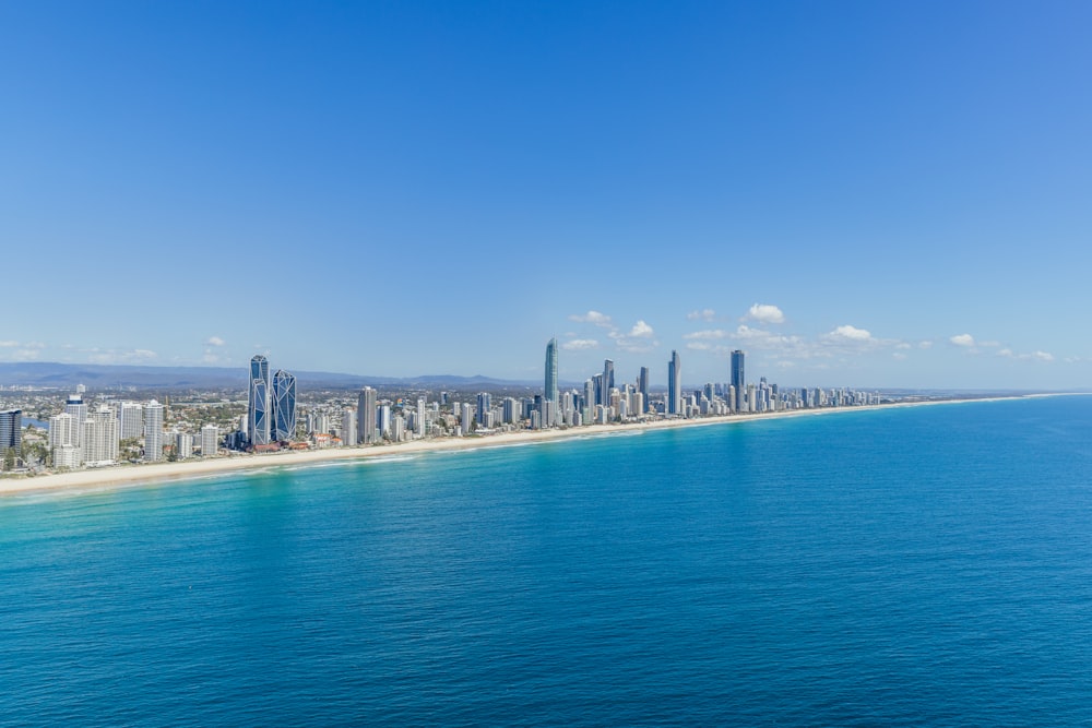 an aerial view of a city and the ocean