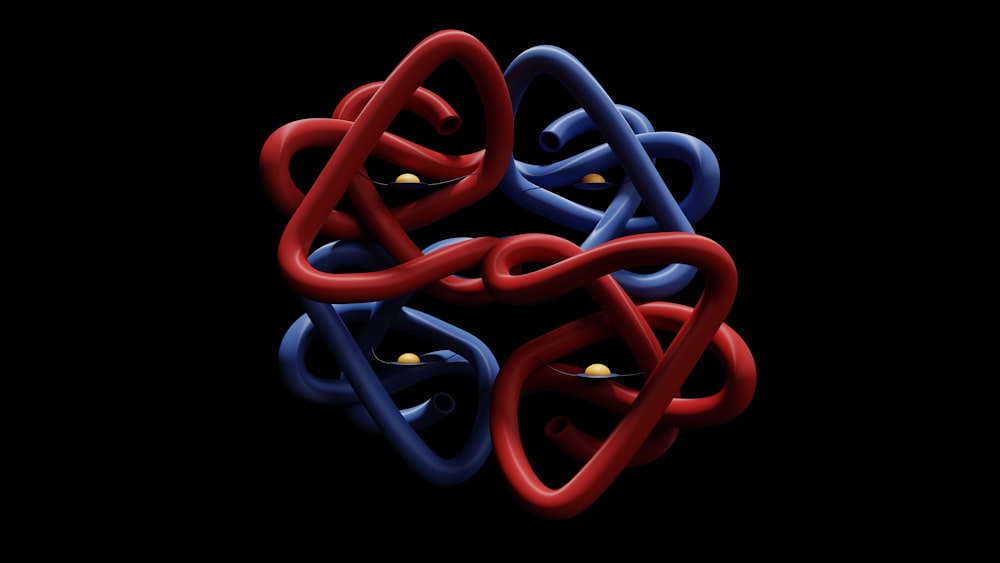 a red, blue and black object with a black background