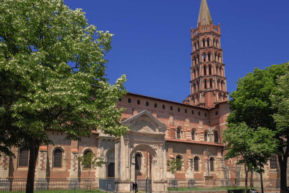 a large building with a tall tower with a clock on it