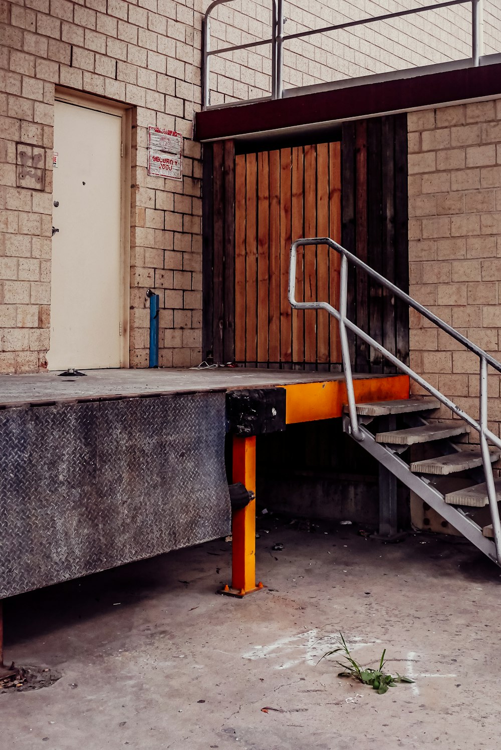 a set of stairs leading up to a brick building