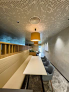 a long table and chairs in a room