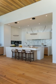 a kitchen with a center island and a breakfast bar