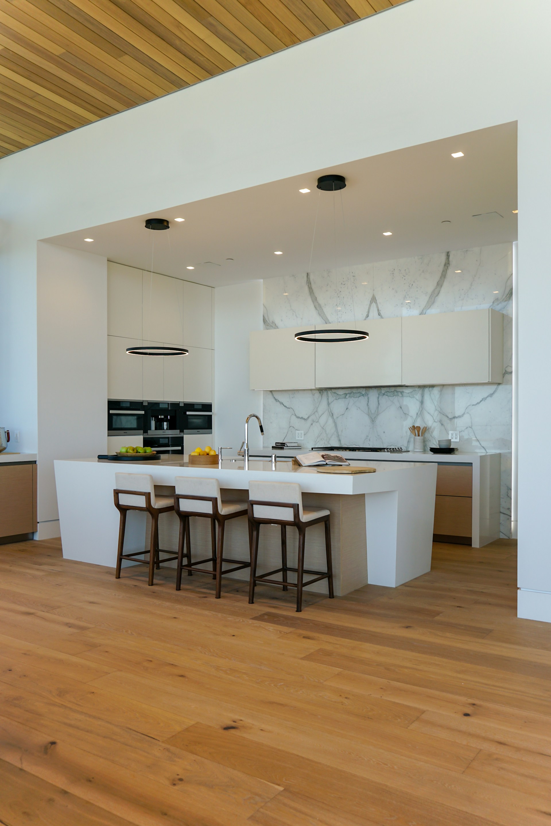 a kitchen with a center island and a breakfast bar