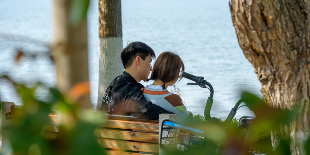 a man and a woman sitting on a bench