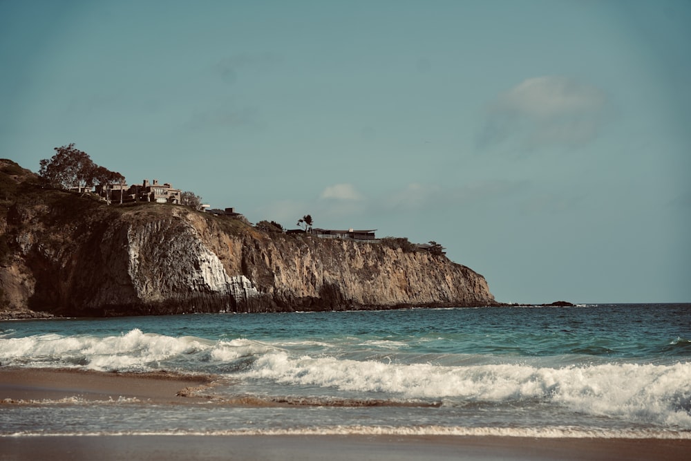 a beach with waves coming in to shore