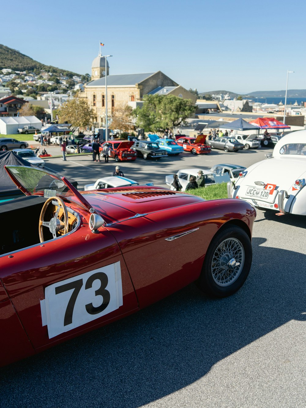 a red sports car parked in a parking lot