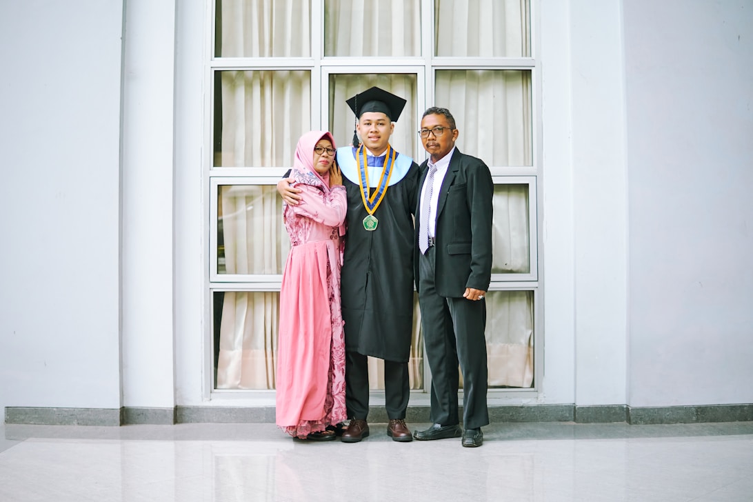 a couple of people that are standing in front of a window