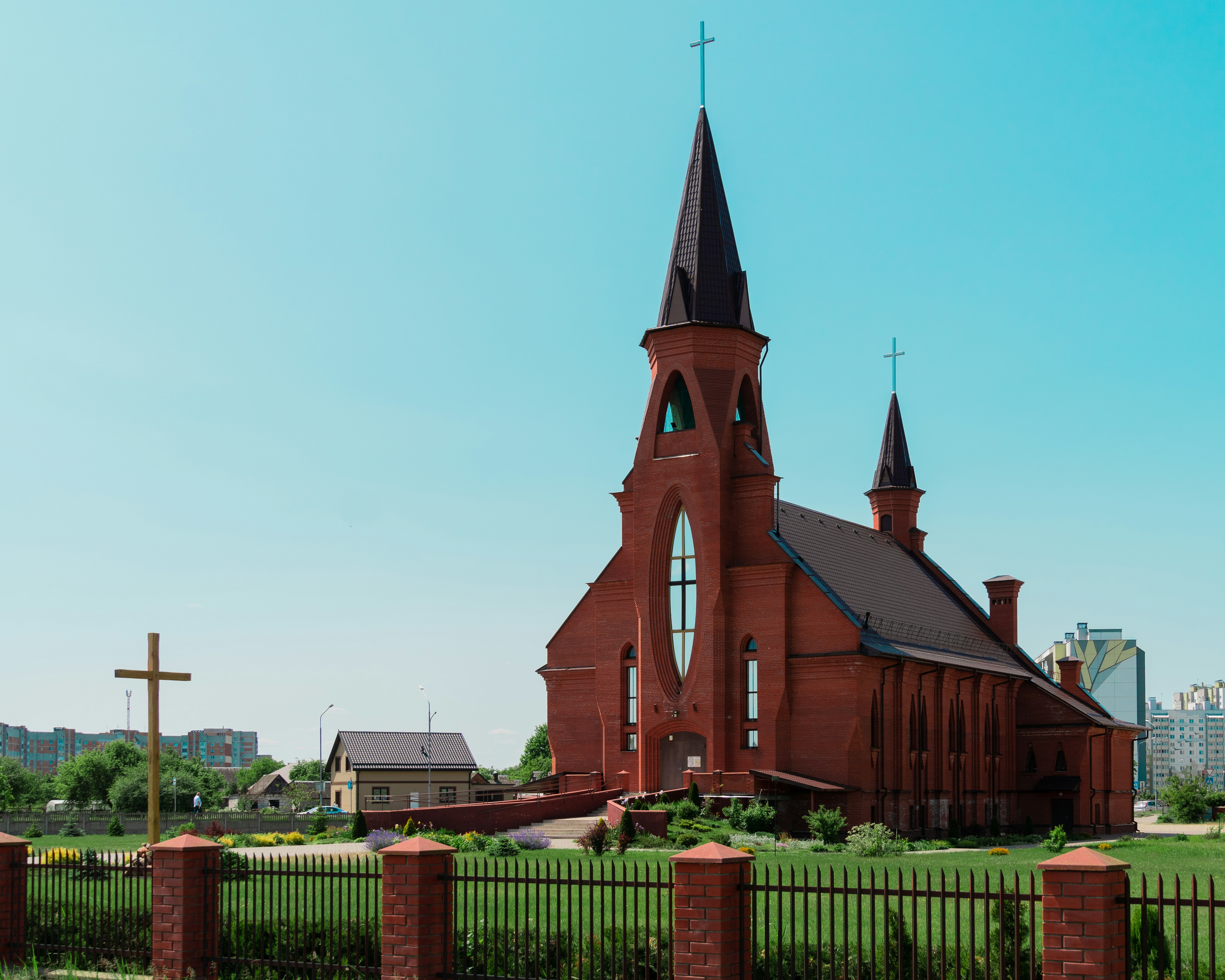 a church with a steeple and a cross on top of it