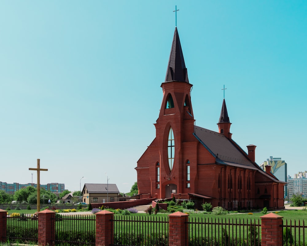 a church with a steeple and a cross on top of it