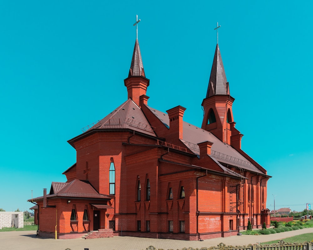 a large red building with two towers on top of it