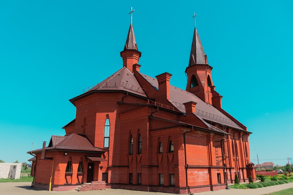 a large red brick building with two towers