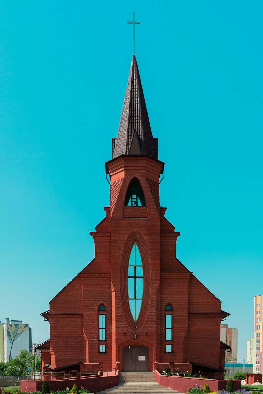 a church with a steeple and a cross on top