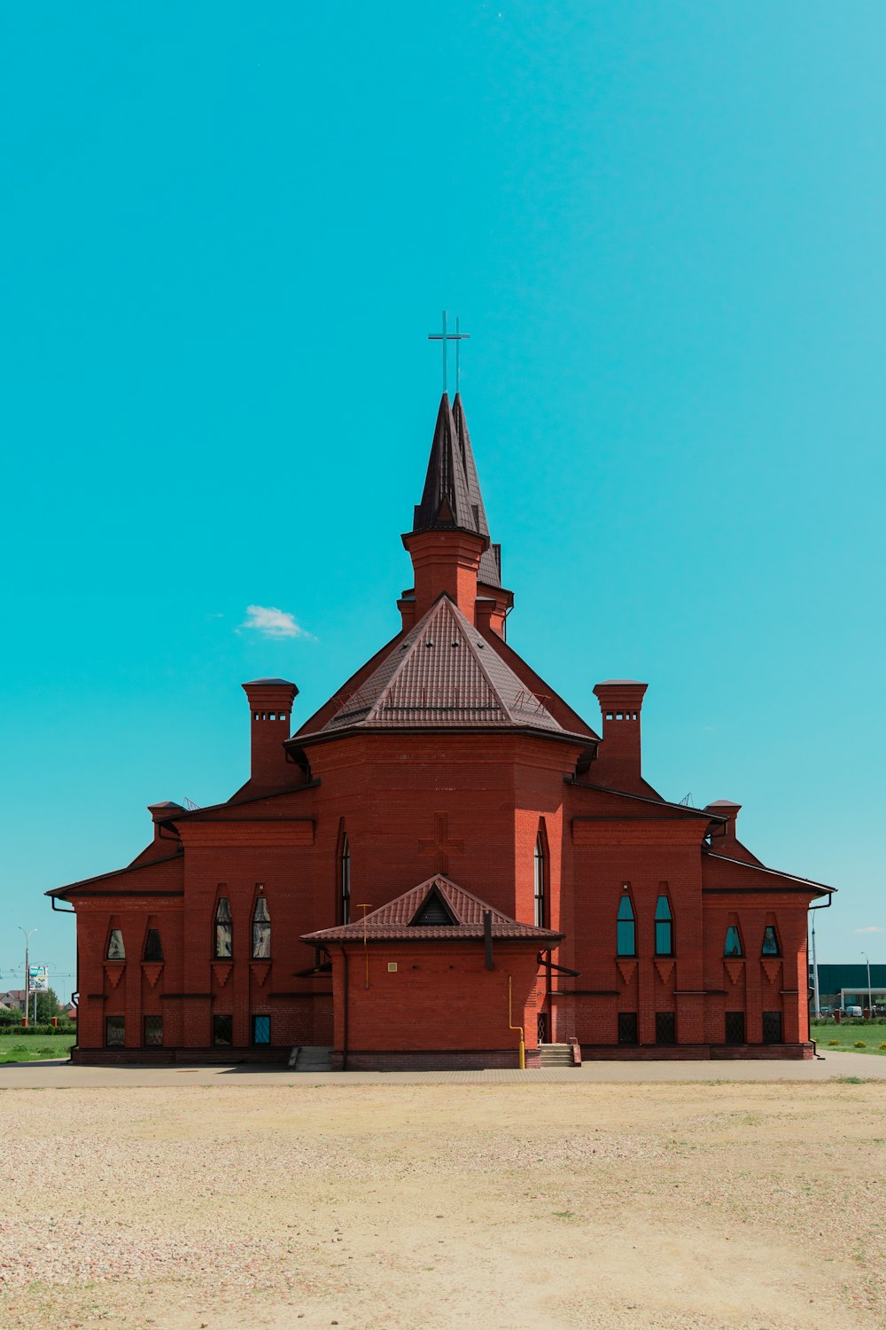 a large red brick building with a steeple on top