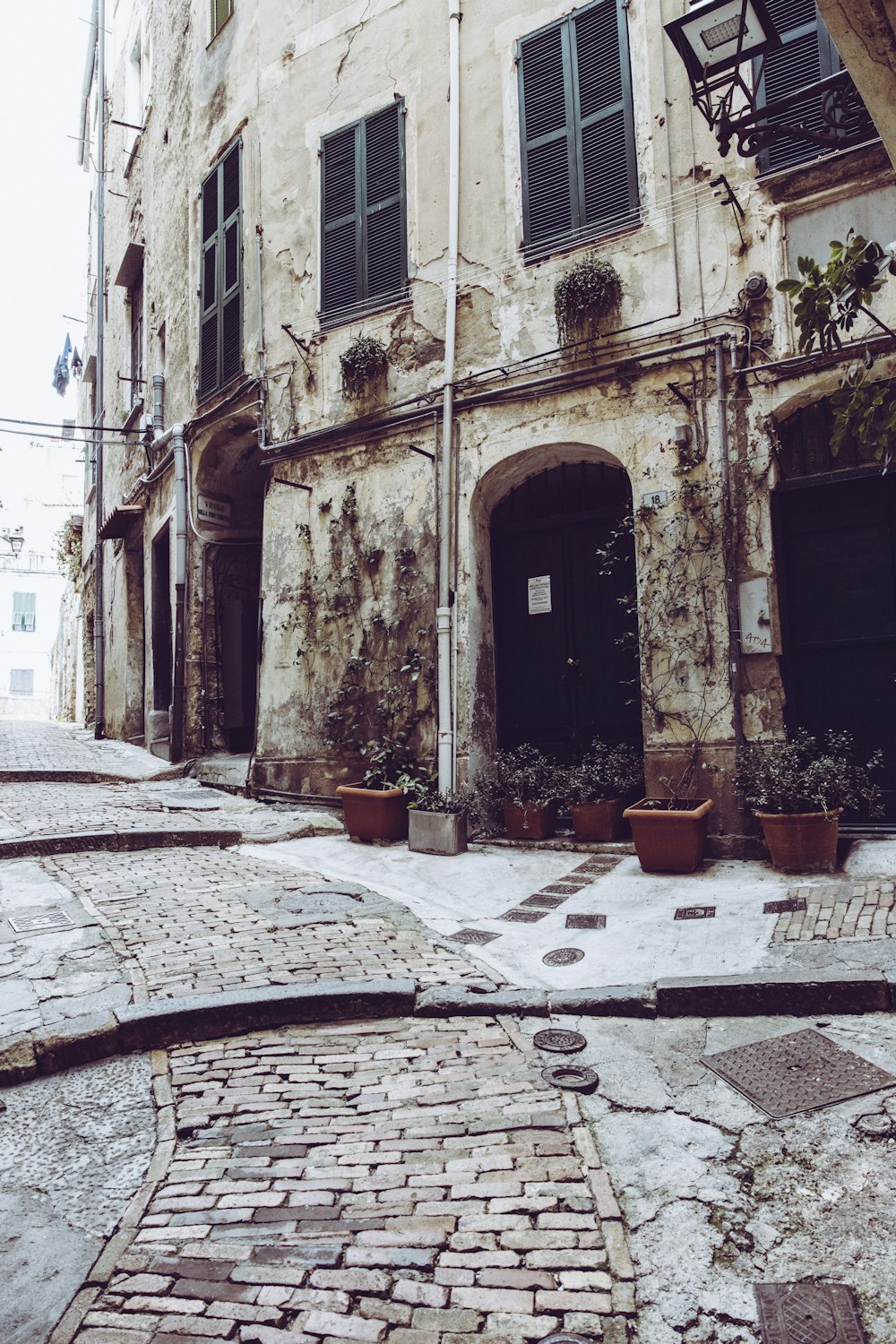 a cobblestone street lined with old buildings