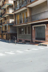 View of the apartment building’s charming facade in a quiet street.