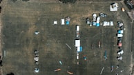Aerial view of multiple temporary structures arranged neatly for a large festival.