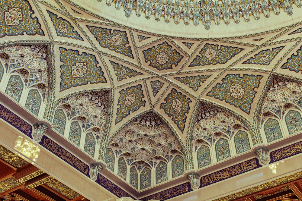 a ceiling in a building with intricate designs