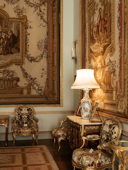 a room with a lot of paintings on the wall
