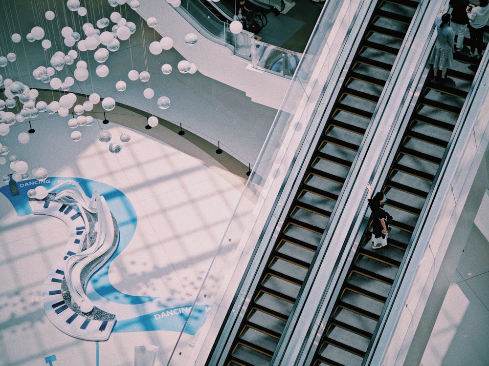 an overhead view of an escalator in a building