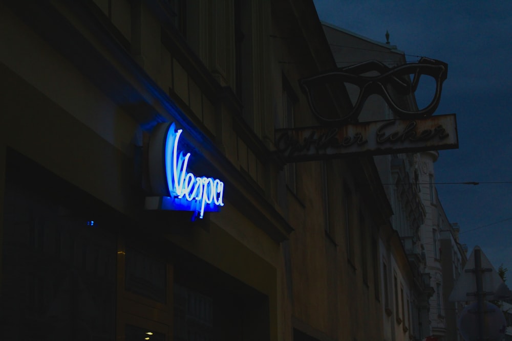 a neon sign on the side of a building