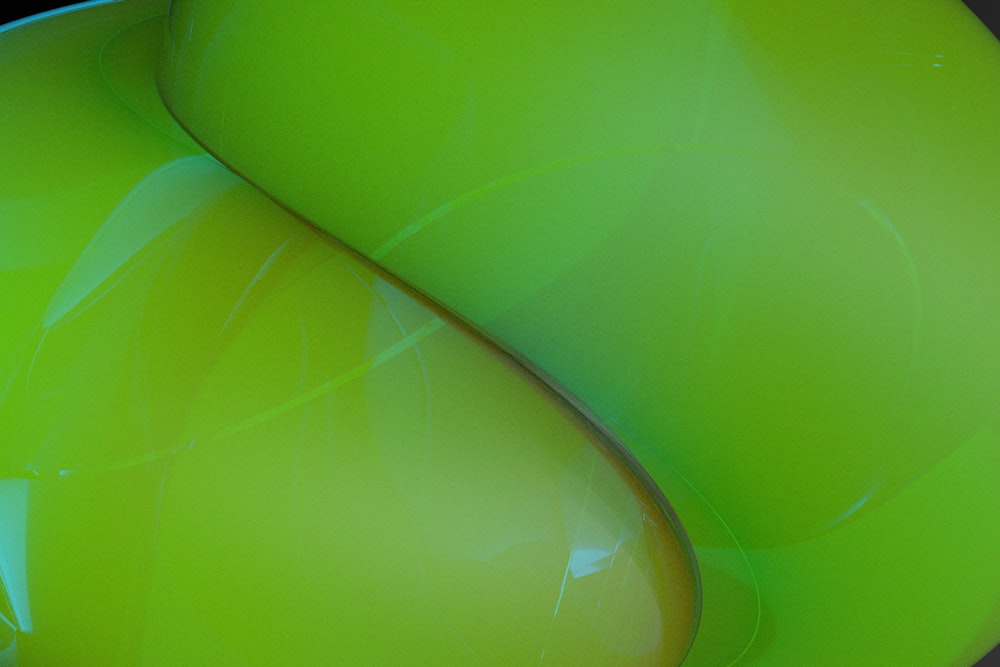 a close up of a green object with a black background