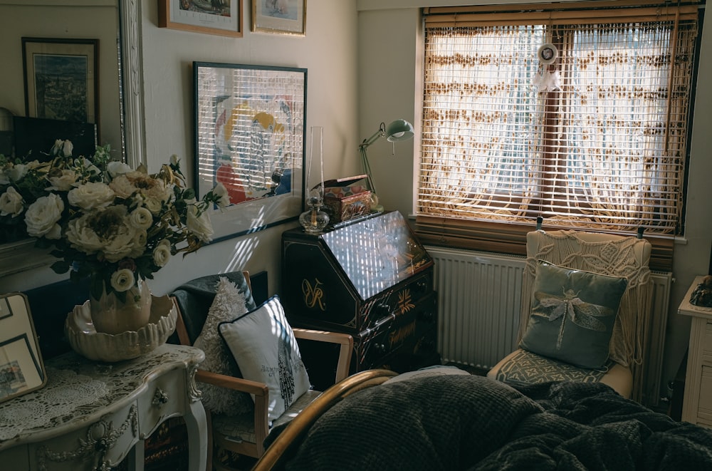 a bedroom with a bed and a desk with a laptop on it