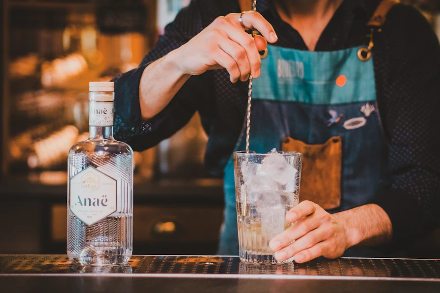 A bartender pouring a drink