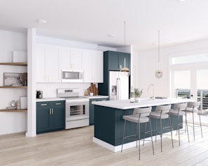 a large kitchen with a center island and bar stools