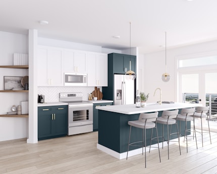 a large kitchen with a center island and bar stools