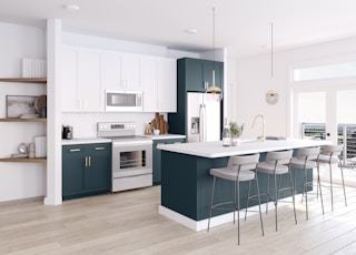 a large kitchen with a center island and bar stools