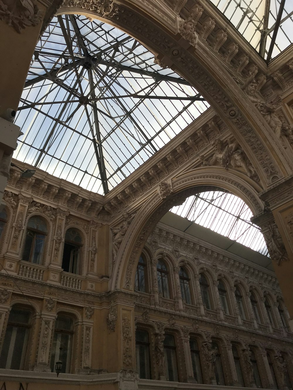 the ceiling of a building with a glass roof