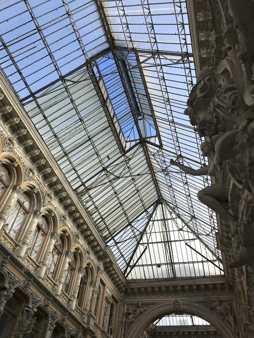 the ceiling of a building with a glass roof