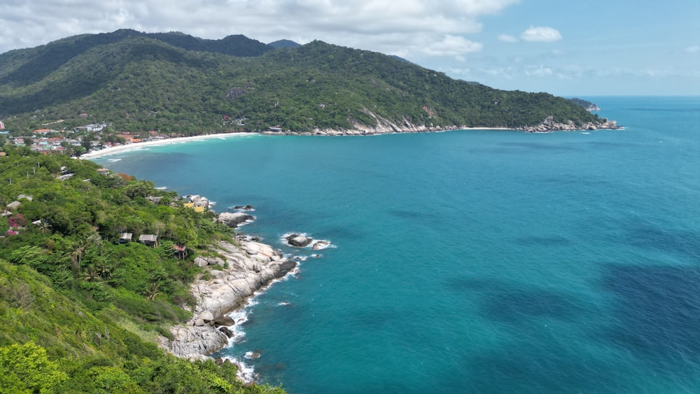 an aerial view of the ocean and a beach