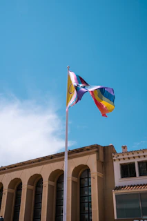 Close-up of the durable aluminum and fiberglass flag structure standing firmly on a busy sidewalk.