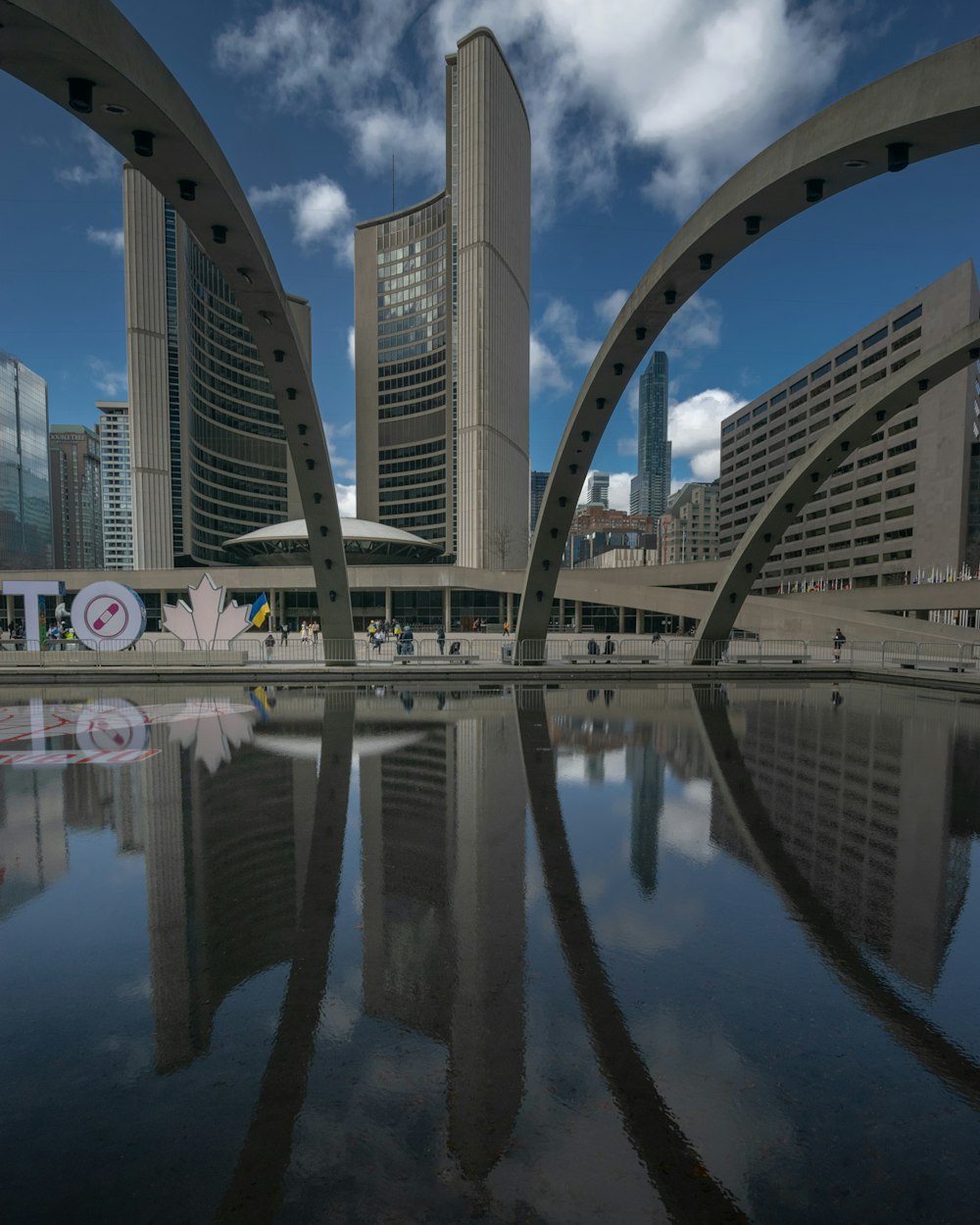 a large body of water with buildings in the background