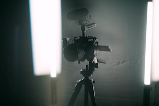 A sleek corporate video shoot setup with professional lighting and camera equipment.
