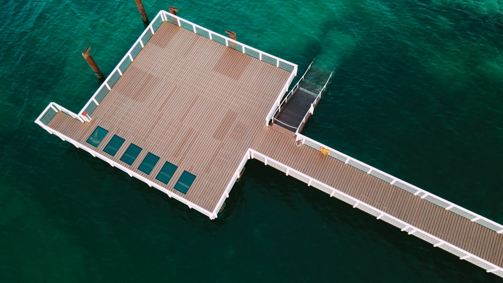 an overhead view of a pier in the water