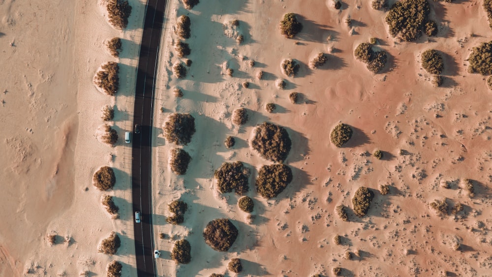 an aerial view of a road in the desert