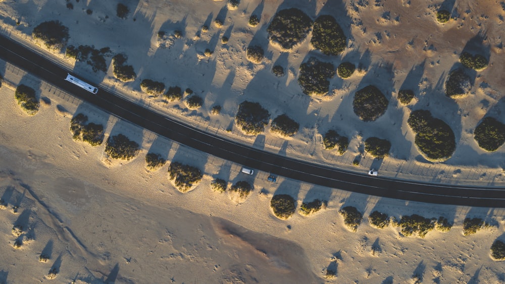 an aerial view of a road in the desert