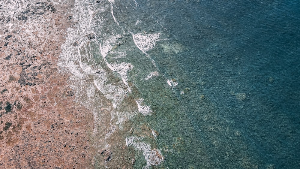 an aerial view of a beach and ocean