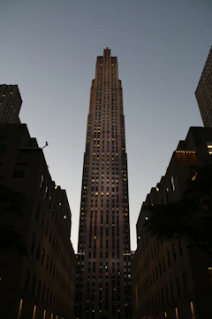 High-quality 3D render of PH Tziara building exterior at dusk with subtle lighting.