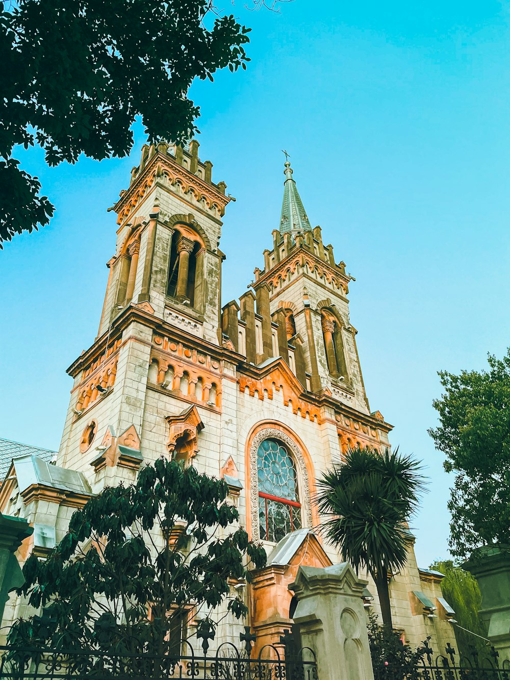 a church with a tall steeple with a clock on it