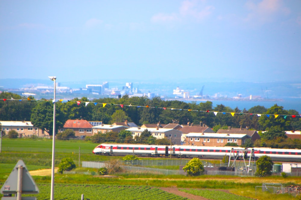 a train traveling through a lush green countryside