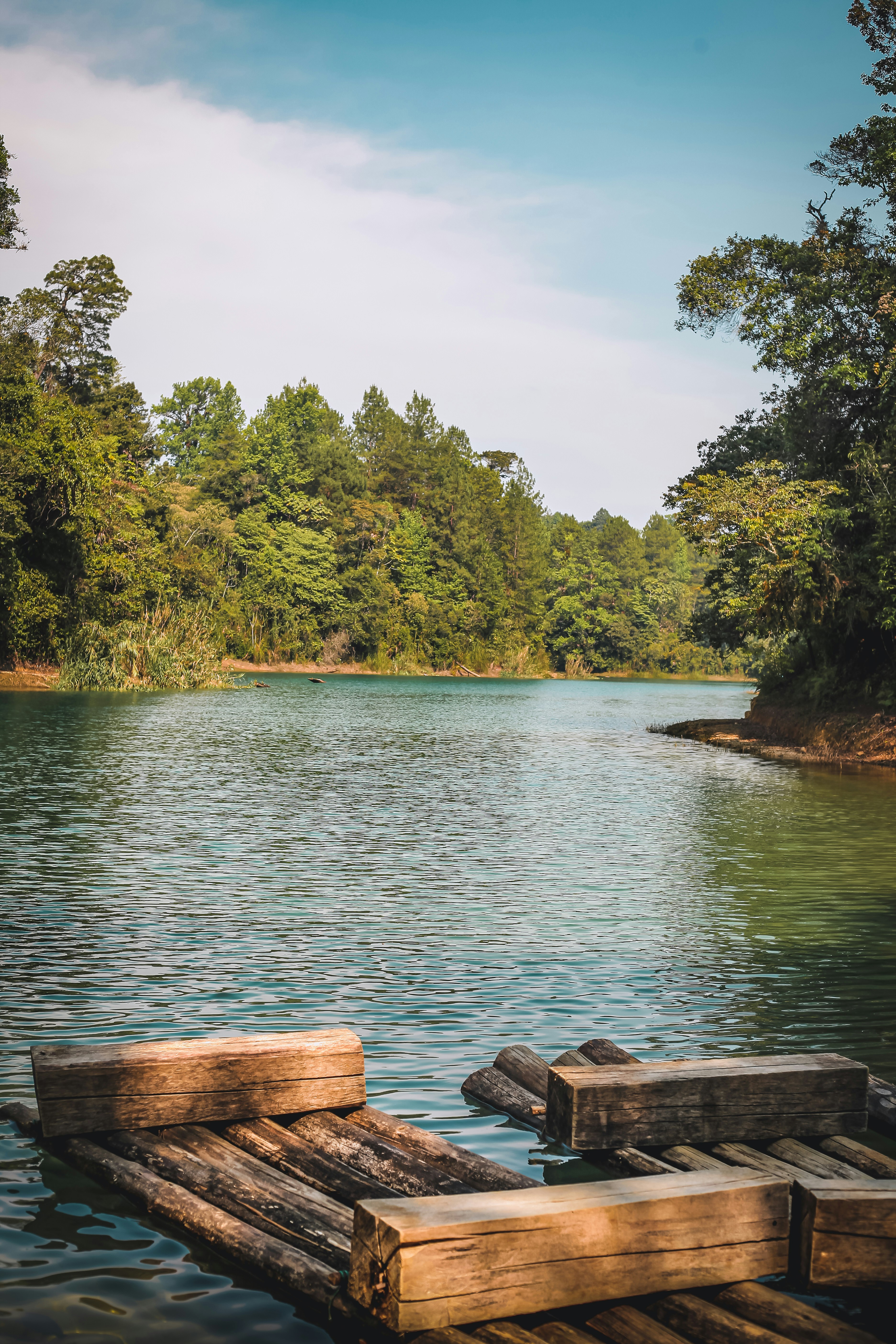 a wooden dock sitting on top of a lake