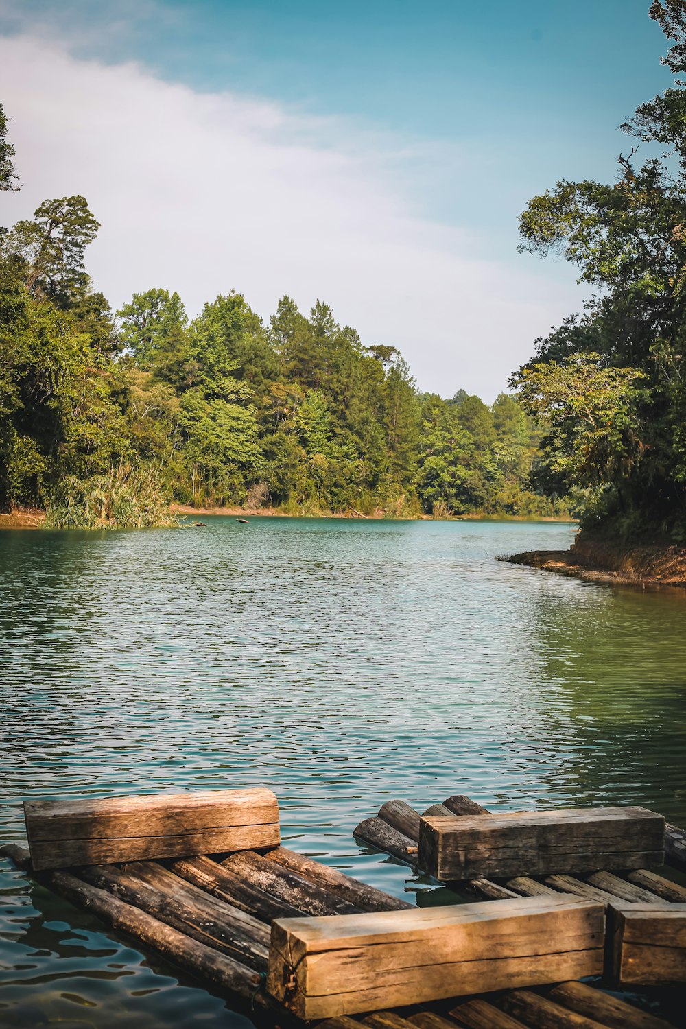 a wooden dock sitting on top of a lake